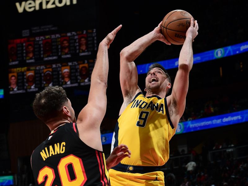 ATLANTA, GA - MARCH 6:  T.J. McConnell #9 of the Indiana Pacers drives to the basket during the game against the Atlanta Hawks on March 6, 2025 at State Farm Arena in Atlanta, Georgia.  NOTE TO USER: User expressly acknowledges and agrees that, by downloading and/or using this Photograph, user is consenting to the terms and conditions of the Getty Images License Agreement. Mandatory Copyright Notice: Copyright 2025 NBAE (Photo by Scott Cunningham/NBAE via Getty Images)