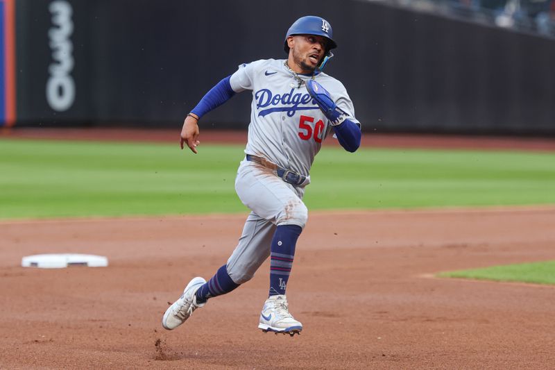 May 25, 2025; New York City, New York, USA;Los Angeles Dodgers shortstop Mookie Betts (50) rounds the bases during a double by first baseman Freddie Freeman (<p><br/></p>p)   during the first inning against the New York Mets at Citi Field. Mandatory Credit: Vincent Carchietta-Imagn Images