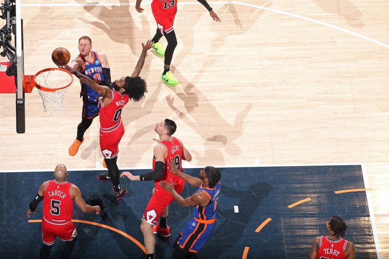 NEW YORK, NY - APRIL 14:  Donte Divincenzo #0 of the New York Knicks shoots the ball during the game against the Chicago Bulls on April 14, 2024 at Madison Square Garden in New York City, New York.  NOTE TO USER: User expressly acknowledges and agrees that, by downloading and or using this photograph, User is consenting to the terms and conditions of the Getty Images License Agreement. Mandatory Copyright Notice: Copyright 2024 NBAE  (Photo by Nathaniel S. Butler/NBAE via Getty Images)