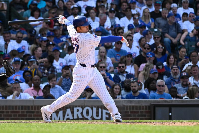 Sep 8, 2024; Chicago, Illinois, USA;  Chicago Cubs outfielder Seiya Suzuki (27) strikes out during the eighth inning against the New York Yankees at Wrigley Field. Mandatory Credit: Matt Marton-Imagn Images