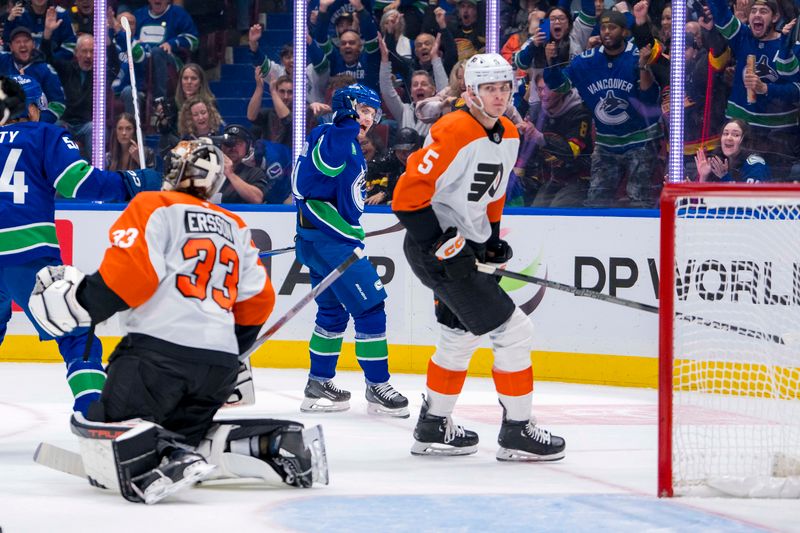 Oct 11, 2024; Vancouver, British Columbia, CAN;  Vancouver Canucks forward Nils Hoglander (21) celebrates his goal scored on Philadelphia Flyers goalie Samuel Ersson (33) during the first period at Rogers Arena. Mandatory Credit: Bob Frid-Imagn Images