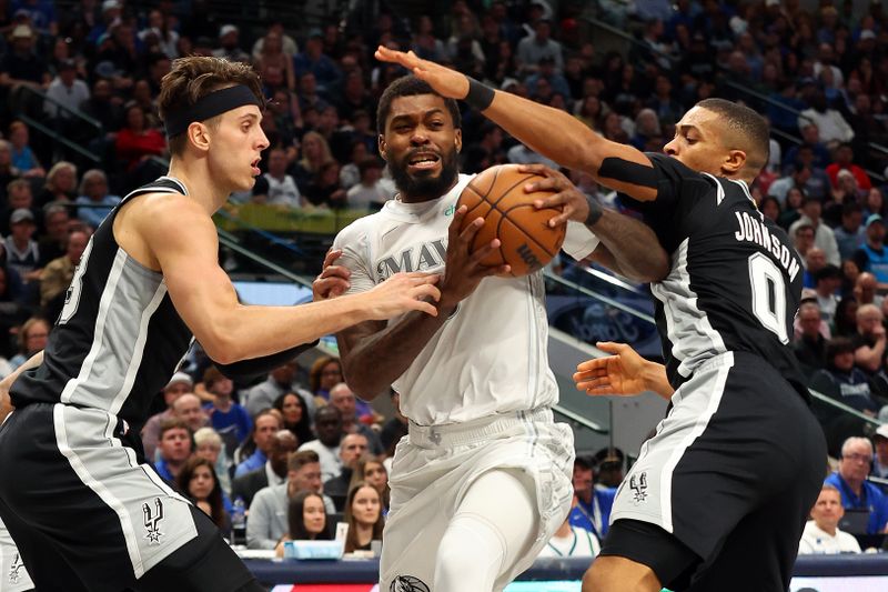 DALLAS, TEXAS - NOVEMBER 16: Naji Marshall #13 of the Dallas Mavericks tries to drive to the basket between Zach Collins #23 of the San Antonio Spurs and Keldon Johnson #0 of the San Antonio Spurs in the second half of an NBA game at American Airlines Center on November 16, 2024 in Dallas, Texas. NOTE TO USER: User expressly acknowledges and agrees that, by downloading and or using this photograph, User is consenting to the terms and conditions of the Getty Images License Agreement. (Photo by Richard Rodriguez/Getty Images)