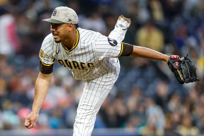 May 17, 2025; San Diego, California, USA; San Diego Padres relief pitcher Jeremiah Estrada (56) throws a pitch during the seventh inning against the Seattle Mariners at Petco Park. Mandatory Credit: David Frerker-Imagn Images