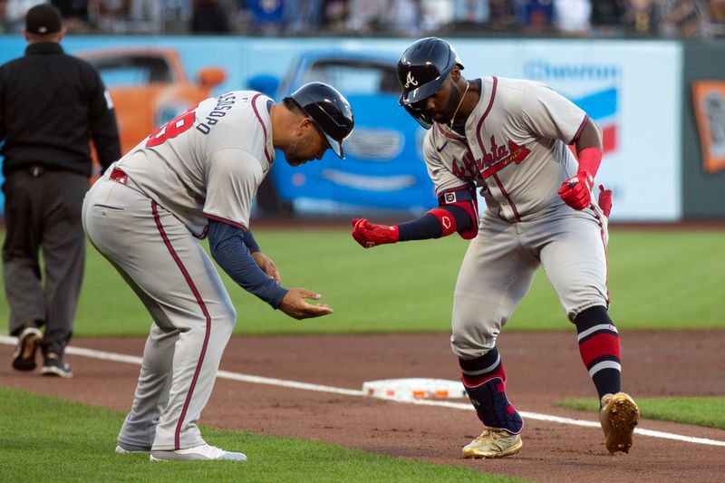 Aug 14, 2024; San Francisco, California, USA; Atlanta Braves center fielder Michael Harris II (23) celebrates his grand slam with third base coach Matt Tuiasosopo (89) during the first inning against the San Francisco Giants at Oracle Park. Mandatory Credit: D. Ross Cameron-USA TODAY Sports