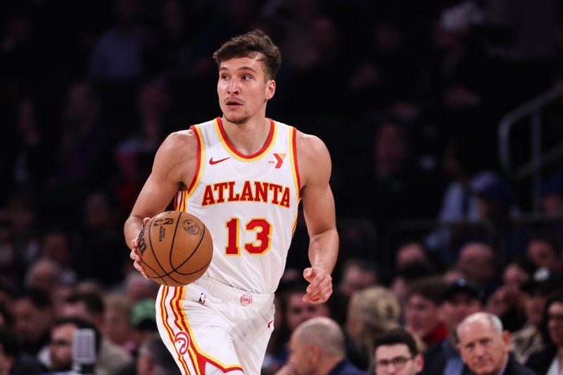 NEW YORK, NEW YORK - MARCH 05: Bogdan Bogdanovic #13 of the Atlanta Hawks brings the ball up the court during the first quarter of the game against the New York Knicks at Madison Square Garden on March 05, 2024 in New York City. NOTE TO USER: User expressly acknowledges and agrees that, by downloading and or using this photograph, User is consenting to the terms and conditions of the Getty Images License Agreement. (Photo by Dustin Satloff/Getty Images)