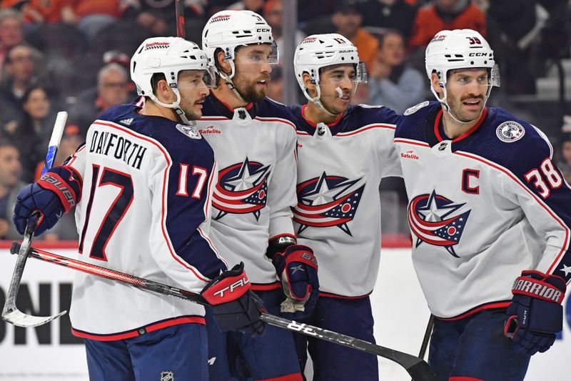 Nov 19, 2023; Philadelphia, Pennsylvania, USA; Columbus Blue Jackets defenseman Ivan Provorov (9) celebrates his goal with with teammates against the Philadelphia Flyers during the second period at Wells Fargo Center. Mandatory Credit: Eric Hartline-USA TODAY Sports