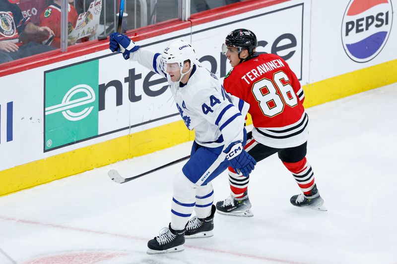 Nov 15, 2025; Chicago, Illinois, USA; Toronto Maple Leafs defenseman Morgan Rielly (44) celebrates after scoring against the Chicago Blackhawks during the second period at United Center. Mandatory Credit: Kamil Krzaczynski-Imagn Images