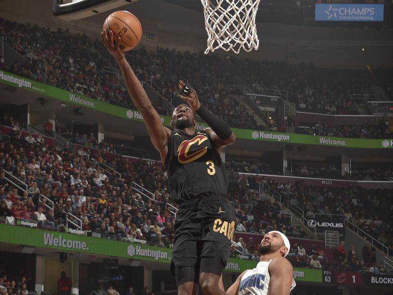 CLEVELAND, OH - NOVEMBER 1: Caris LeVert #3 of the Cleveland Cavaliers drives to the basket during the game against the Orlando Magic on November 1, 2024 at Rocket Mortgage FieldHouse in Cleveland, Ohio. NOTE TO USER: User expressly acknowledges and agrees that, by downloading and/or using this Photograph, user is consenting to the terms and conditions of the Getty Images License Agreement. Mandatory Copyright Notice: Copyright 2024 NBAE (Photo by David Liam Kyle/NBAE via Getty Images)