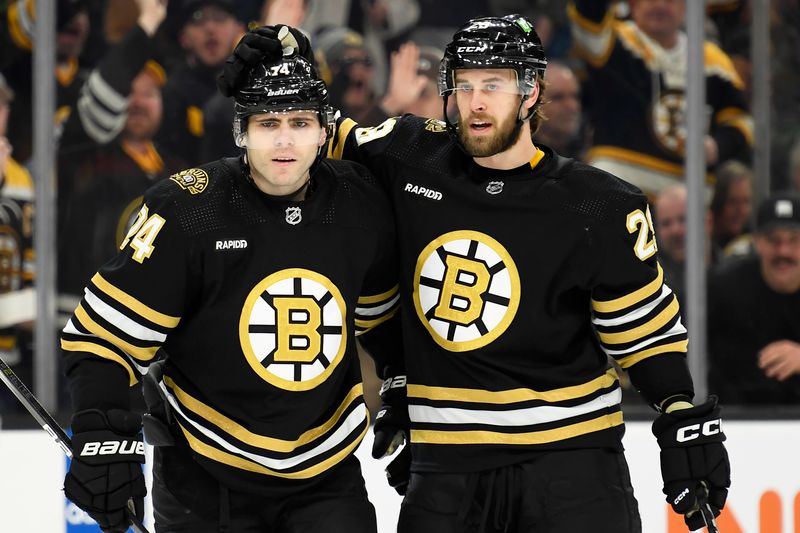 Jan 18, 2024; Boston, Massachusetts, USA; Boston Bruins defenseman Parker Wotherspoon (29) celebrates a goal scored by left wing Jake DeBrusk (74) during the first against the Colorado Avalanche period at TD Garden. Mandatory Credit: Bob DeChiara-USA TODAY Sports