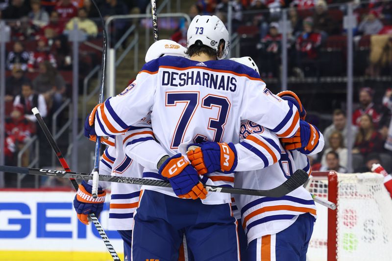 Dec 21, 2023; Newark, New Jersey, USA; Edmonton Oilers center Ryan McLeod (71) celebrates his goal against the New Jersey Devils during the first period at Prudential Center. Mandatory Credit: Ed Mulholland-USA TODAY Sports