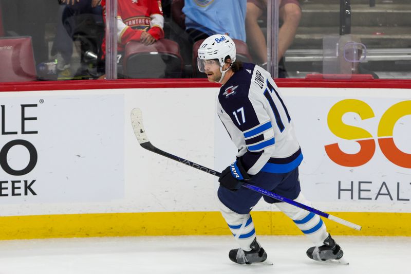 Nov 24, 2023; Sunrise, Florida, USA; Winnipeg Jets center Adam Lowry (17) looks on after scoring against the Florida Panthers during the third period at Amerant Bank Arena. Mandatory Credit: Sam Navarro-USA TODAY Sports