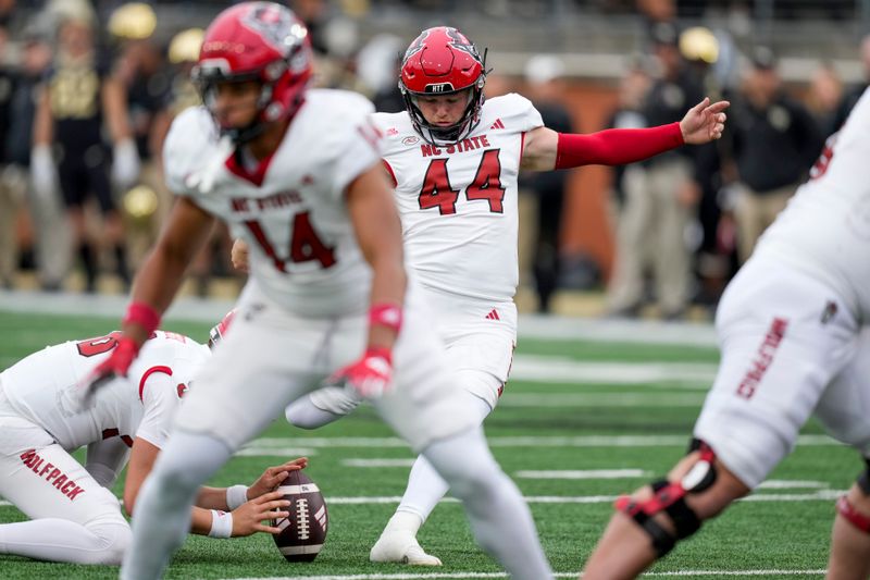 Nov 11, 2023; Winston-Salem, North Carolina, USA; North Carolina State Wolfpack place kicker Brayden Narveson (44) adds an extra point during the first half against the Wake Forest Demon Deacons at Allegacy Federal Credit Union Stadium. Mandatory Credit: Jim Dedmon-USA TODAY Sports