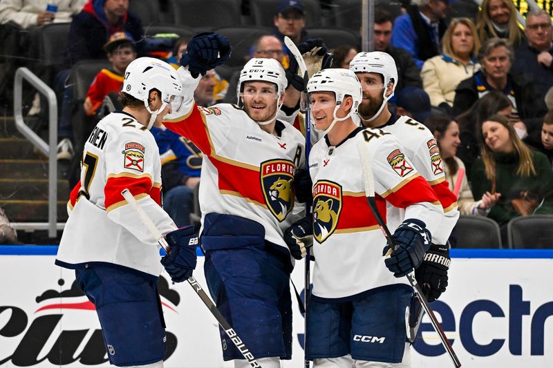 Jan 9, 2024; St. Louis, Missouri, USA;  Florida Panthers left wing Matthew Tkachuk (19) celebrates with center Eetu Luostarinen (27) defenseman Gustav Forsling (42) and defenseman Aaron Ekblad (5) after scoring his second goal of the game against the St. Louis Blues during the third period at Enterprise Center. Mandatory Credit: Jeff Curry-USA TODAY Sports