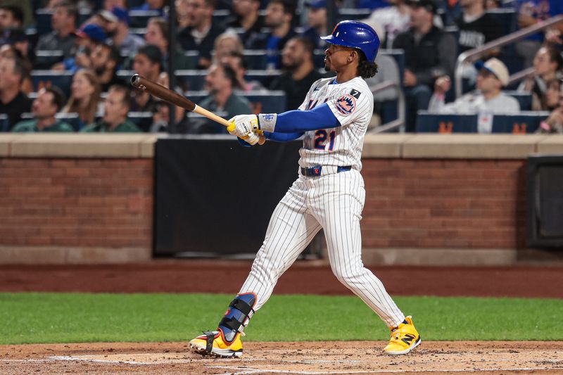 Sep 16, 2025; New York City, New York, USA; New York Mets shortstop Francisco Lindor (12) hits a solo home run during the second inning against the San Diego Padres at Citi Field. Mandatory Credit: Vincent Carchietta-Imagn Images