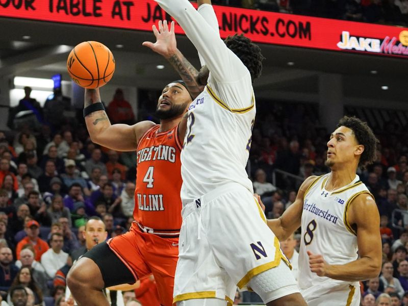 Jan 14, 2026; Evanston, Illinois, USA; Northwestern Wildcats forward Arrinten Page (22) defends Illinois Fighting Illini guard Kylan Boswell (4) during the first half at Welsh-Ryan Arena. Mandatory Credit: David Banks-Imagn Images