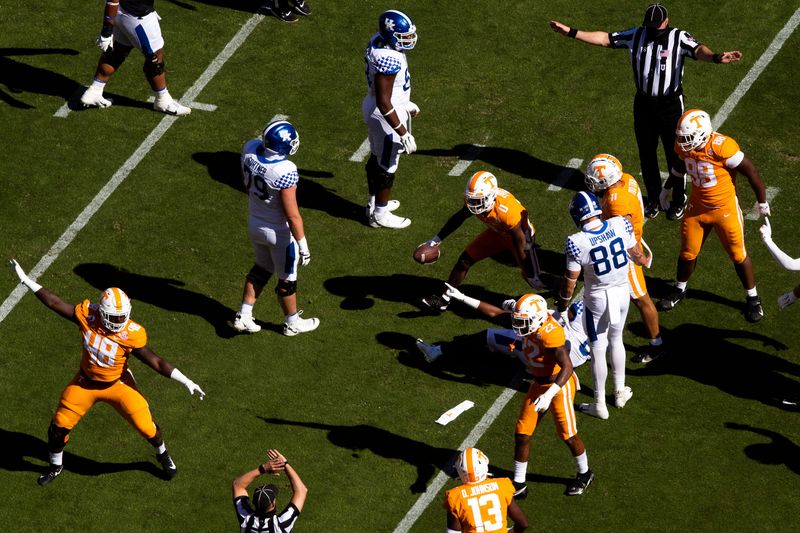 Oct 17, 2020; Knoxville, TN, USA; Tennessee defensive players signal a fumble as Tennessee defensive back Bryce Thompson (0) comes out of the pile with the ball during a SEC conference football game between the Tennessee Volunteers and the Kentucky Wildcats held at Neyland Stadium in Knoxville, Tenn., on Saturday, October 17, 2020. Mandatory Credit: Brianna Paciorka-USA TODAY NETWORK