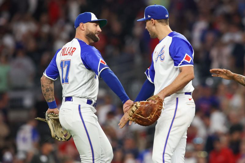 May 6, 2023; Atlanta, Georgia, USA; Atlanta Braves left fielder Kevin Pillar (17) and first baseman Matt Olson (28) celebrate after defeating the Baltimore Orioles at Truist Park. Mandatory Credit: Brett Davis-USA TODAY Sports