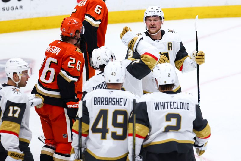 Nov 13, 2024; Anaheim, California, USA; Vegas Golden Knights center Jack Eichel (9) celebrates with left wing Pavel Dorofeyev (16) and additional teammates after a goal against the Anaheim Ducks during the third period of a hockey game at Honda Center. Mandatory Credit: Jessica Alcheh-Imagn Images