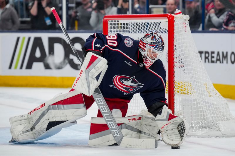 Nov 29, 2023; Columbus, Ohio, USA;  Columbus Blue Jackets goaltender Elvis Merzlikins (90) makes a save in net against the Montreal Canadiens in the first period at Nationwide Arena. Mandatory Credit: Aaron Doster-USA TODAY Sports