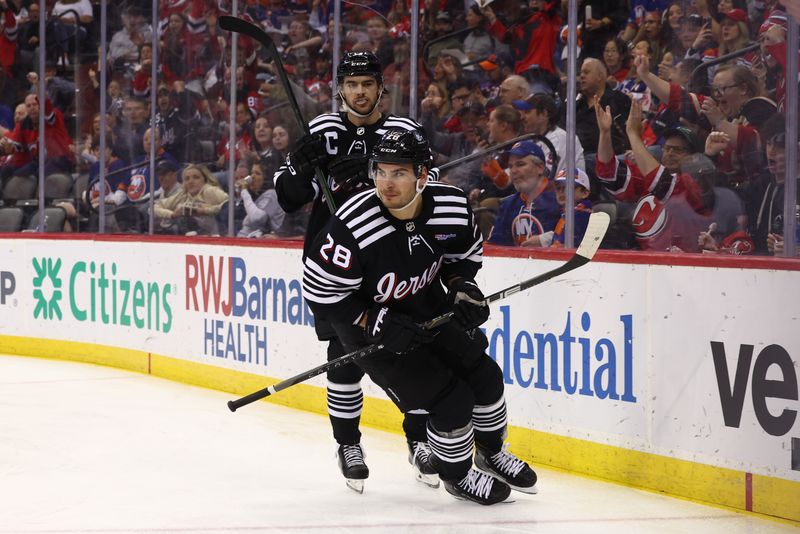 Apr 15, 2024; Newark, New Jersey, USA; New Jersey Devils right wing Timo Meier (28) celebrates his goal against the New York Islanders during the second period at Prudential Center. Mandatory Credit: Ed Mulholland-USA TODAY Sports