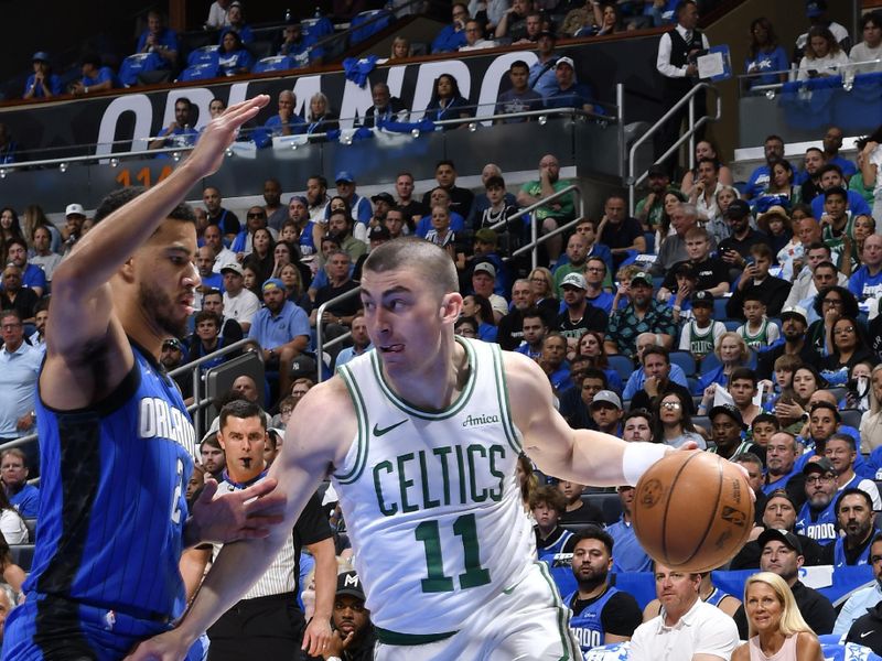 ORLANDO, FL - APRIL 27:  Payton Pritchard #11 of the Boston Celtics dribbles the ball during the game against the Orlando Magic  during Round 1 Game 4 of the 2025 NBA Playoffs on April 27, 2025 at Kia Center in Orlando, Florida. NOTE TO USER: User expressly acknowledges and agrees that, by downloading and or using this photograph, User is consenting to the terms and conditions of the Getty Images License Agreement. Mandatory Copyright Notice: Copyright 2025 NBAE (Photo by Gary Bassing/NBAE via Getty Images)