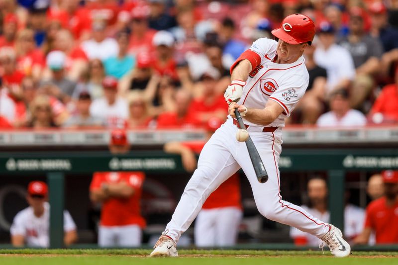 May 26, 2024; Cincinnati, Ohio, USA; Cincinnati Reds outfielder Jacob Hurtubise (26) hits a single against the Los Angeles Dodgers in the third inning at Great American Ball Park. Mandatory Credit: Katie Stratman-USA TODAY Sports