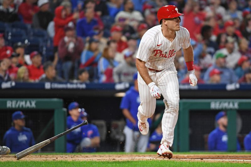 Sep 23, 2024; Philadelphia, Pennsylvania, USA; Philadelphia Phillies catcher J.T. Realmuto (10) hits a home run during the second inning against the Chicago Cubs at Citizens Bank Park. Mandatory Credit: Eric Hartline-Imagn Images