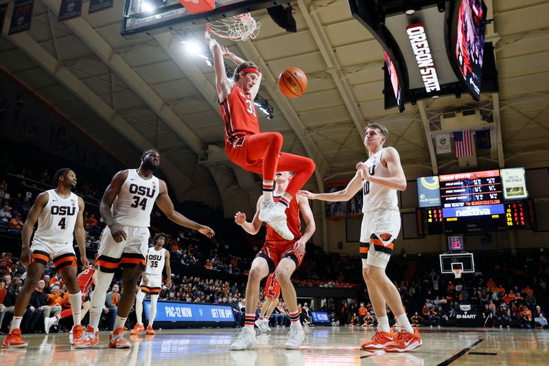 Jan 26, 2023; Corvallis, Oregon, USA; Utah Utes center Branden Carlson (35) dunks the ball past Oregon State Beavers forward Rodrigue Angela (34) during the second half at Gill Coliseum. Mandatory Credit: Soobum Im-USA TODAY Sports