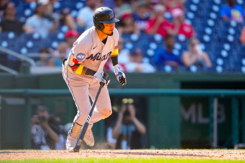 Sep 3, 2023; Washington, District of Columbia, USA;  Miami Marlins second baseman Luis Arraez (3) hits a single against the Washington Nationals during the ninth inning at Nationals Park. Mandatory Credit: Gregory Fisher-USA TODAY Sports