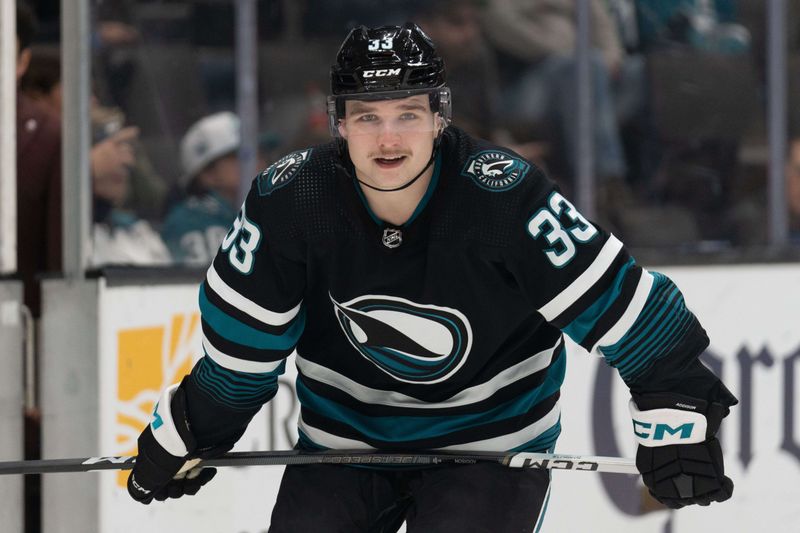 Mar 7, 2024; San Jose, California, USA; San Jose Sharks defenseman Calen Addison (33) smiles during the first period against the New York Islanders at SAP Center at San Jose. Mandatory Credit: Stan Szeto-USA TODAY Sports