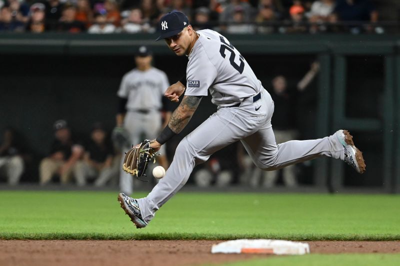 May 1, 2024; Baltimore, Maryland, USA;  New York Yankees second baseman Gleyber Torres (25) attempts to flied Baltimore Orioles outfielder Colton Cowser (17) ninth inning ground ball at Oriole Park at Camden Yards. Mandatory Credit: Tommy Gilligan-USA TODAY Sports