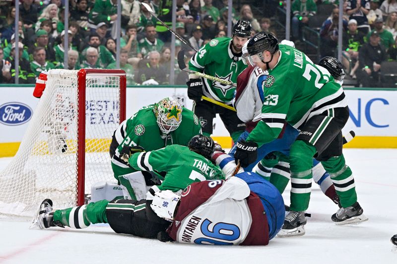 May 9, 2024; Dallas, Texas, USA; Dallas Stars goaltender Jake Oettinger (29) and defenseman Chris Tanev (3) and defenseman Esa Lindell (23) cover up the puck in front of Colorado Avalanche right wing Mikko Rantanen (96) during the third period in game two of the second round of the 2024 Stanley Cup Playoffs at American Airlines Center. Mandatory Credit: Jerome Miron-USA TODAY Sports