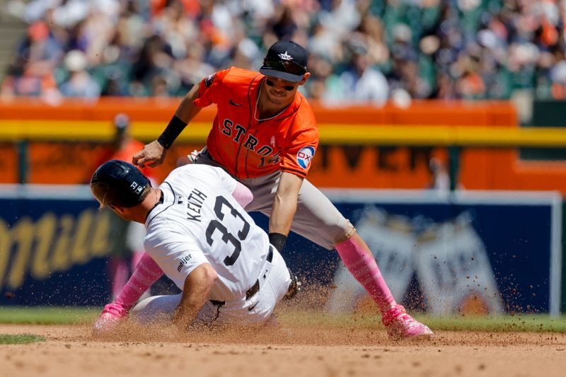 May 12, 2024; Detroit, Michigan, USA;  Houston Astros second baseman Mauricio Dubon (14) tags Detroit Tigers second baseman Colt Keith (33) out trying to steal second base in the fifth inning at Comerica Park. Mandatory Credit: Rick Osentoski-USA TODAY Sports