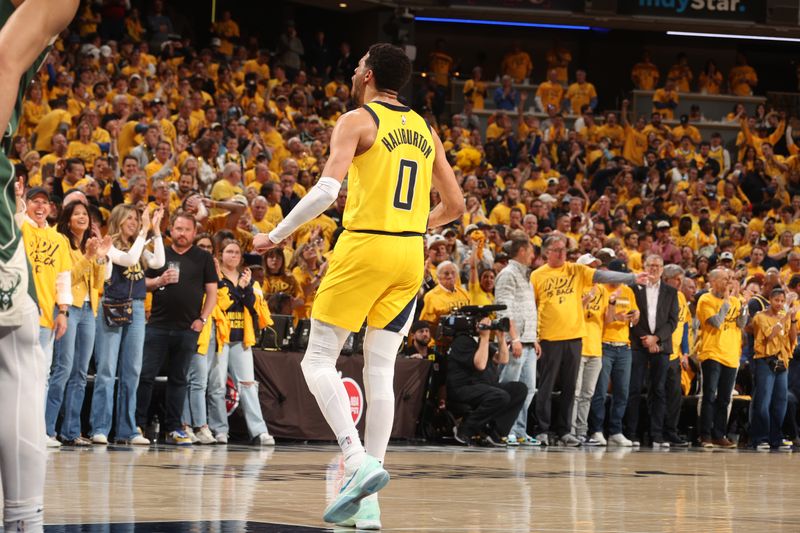 INDIANAPOLIS, IN - APRIL 26: Tyrese Haliburton #0 of the Indiana Pacers celebrates after hitting the game winning shot during the game against the Milwaukee Bucks during Round 1 Game 3 of the 2024 NBA Playoffs on April 26, 2024 at Gainbridge Fieldhouse in Indianapolis, Indiana. NOTE TO USER: User expressly acknowledges and agrees that, by downloading and or using this Photograph, user is consenting to the terms and conditions of the Getty Images License Agreement. Mandatory Copyright Notice: Copyright 2023 NBAE (Photo by Nathaniel S. Butler/NBAE via Getty Images)