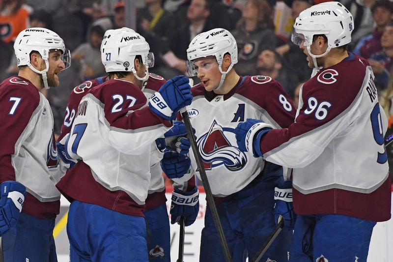 Nov 18, 2024; Philadelphia, Pennsylvania, USA; Colorado Avalanche defenseman Cale Makar (8) celebrates his goal with teammates against the Philadelphia Flyers during the second period at Wells Fargo Center. Mandatory Credit: Eric Hartline-Imagn Images