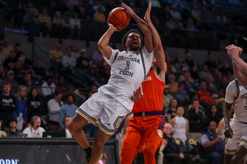 Feb 21, 2024; Atlanta, Georgia, USA; Georgia Tech Yellow Jackets guard Kyle Sturdivant (1) shoots past Clemson Tigers guard Chase Hunter (1) in the second half at McCamish Pavilion. Mandatory Credit: Brett Davis-USA TODAY Sports