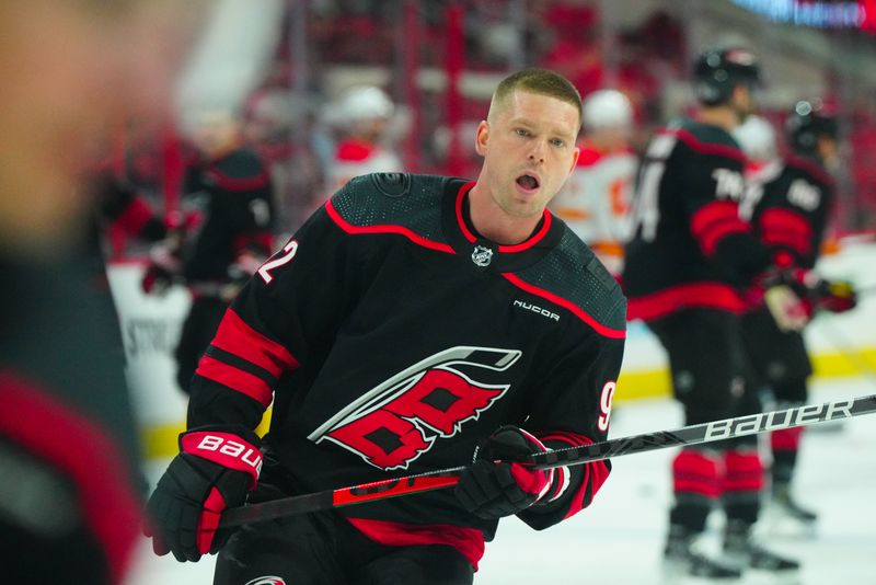 Mar 10, 2024; Raleigh, North Carolina, USA;  Carolina Hurricanes center Evgeny Kuznetsov (92) skates during the warmups before the game against the Calgary Flames at PNC Arena. Mandatory Credit: James Guillory-USA TODAY Sports