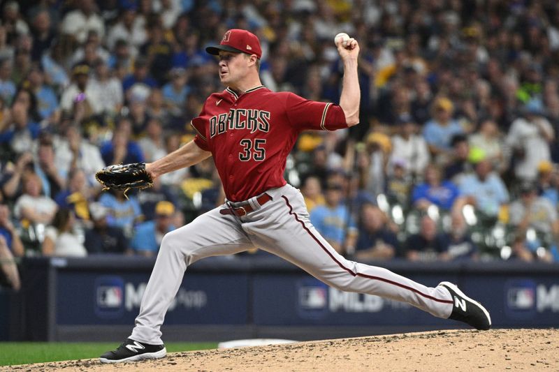 Oct 3, 2023; Milwaukee, Wisconsin, USA; Arizona Diamondbacks relief pitcher Joe Mantiply (35) pitches in the third inning against the Milwaukee Brewers during game one of the Wildcard series for the 2023 MLB playoffs at American Family Field. Mandatory Credit: Michael McLoone-USA TODAY Sports