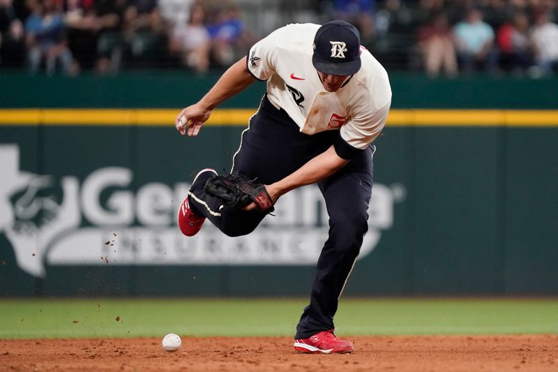 Sep 1, 2023; Arlington, Texas, USA; Texas Rangers shortstop Corey Seager (5) can not make a play on batted ball during the ninth inning against the Minnesota Twins at Globe Life Field. Mandatory Credit: Raymond Carlin III-USA TODAY Sports