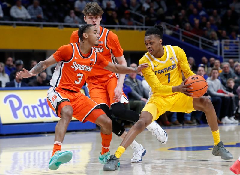 Jan 16, 2024; Pittsburgh, Pennsylvania, USA; Pittsburgh Panthers guard Carlton Carrington (7) handles the ball as Syracuse Orange guard Judah Mintz (3) defends during the first half  at the Petersen Events Center. Mandatory Credit: Charles LeClaire-USA TODAY Sports