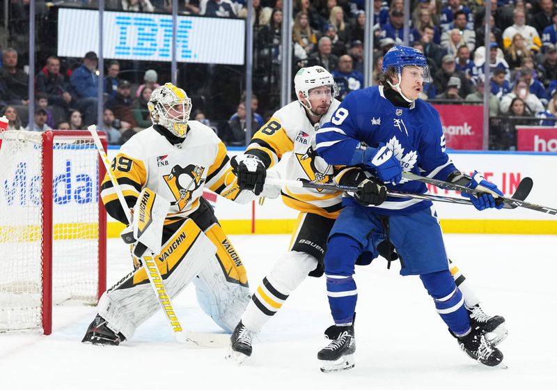 Apr 8, 2024; Toronto, Ontario, CAN; Toronto Maple Leafs left wing Tyler Bertuzzi (59) battles with Pittsburgh Penguins defenseman Marcus Pettersson (28) in front of  goaltender Alex Nedeljkovic (39) during the third period at Scotiabank Arena. Mandatory Credit: Nick Turchiaro-USA TODAY Sports