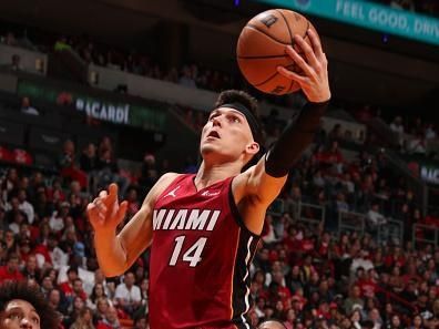 MIAMI, FL - DECEMBER 25:  Tyler Herro #14 of the Miami Heat goes to the basket during the game on December 25, 2023 at Kaseya Center Arena in Miami, Florida. NOTE TO USER: User expressly acknowledges and agrees that, by downloading and or using this Photograph, user is consenting to the terms and conditions of the Getty Images License Agreement. Mandatory Copyright Notice: Copyright 2023 NBAE (Photo by Issac Baldizon/NBAE via Getty Images)