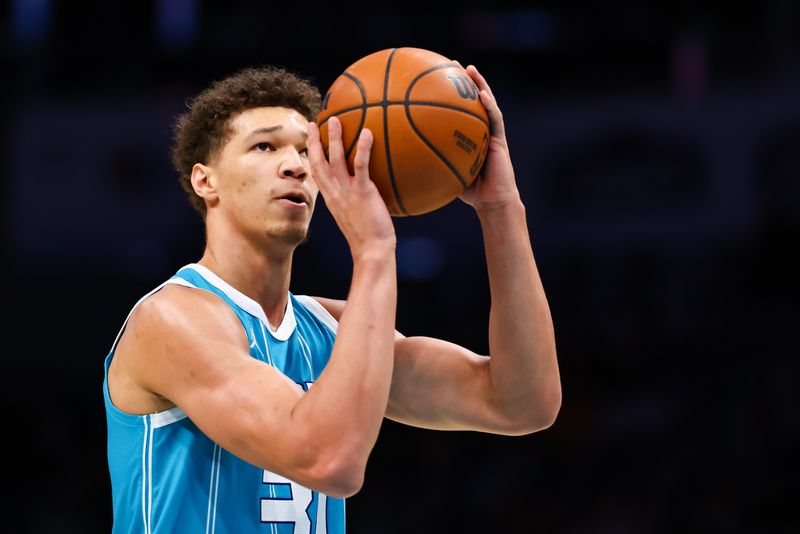 CHARLOTTE, NORTH CAROLINA - NOVEMBER 21: Tidjane Salaun #31 of the Charlotte Hornets shoots a free throw during the second half of a basketball game against the Detroit Pistons at Spectrum Center on November 21, 2024 in Charlotte, North Carolina. NOTE TO USER: User expressly acknowledges and agrees that, by downloading and or using this photograph, User is consenting to the terms and conditions of the Getty Images License Agreement. (Photo by David Jensen/Getty Images)