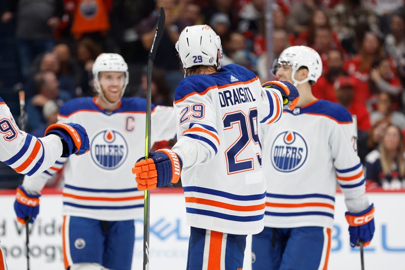 Nov 24, 2023; Washington, District of Columbia, USA; Edmonton Oilers center Leon Draisaitl (29) celebrates with teammates after scoring a goal against the Washington Capitals in the second period at Capital One Arena. Mandatory Credit: Geoff Burke-USA TODAY Sports
