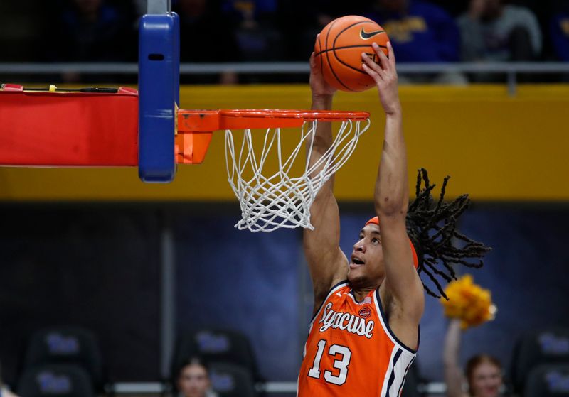 Jan 16, 2024; Pittsburgh, Pennsylvania, USA; Syracuse Orange forward Benny Williams (13) dunks the ball against the Pittsburgh Panthers during the second half at the Petersen Events Center. Syracuse won 69-58. Mandatory Credit: Charles LeClaire-USA TODAY Sports