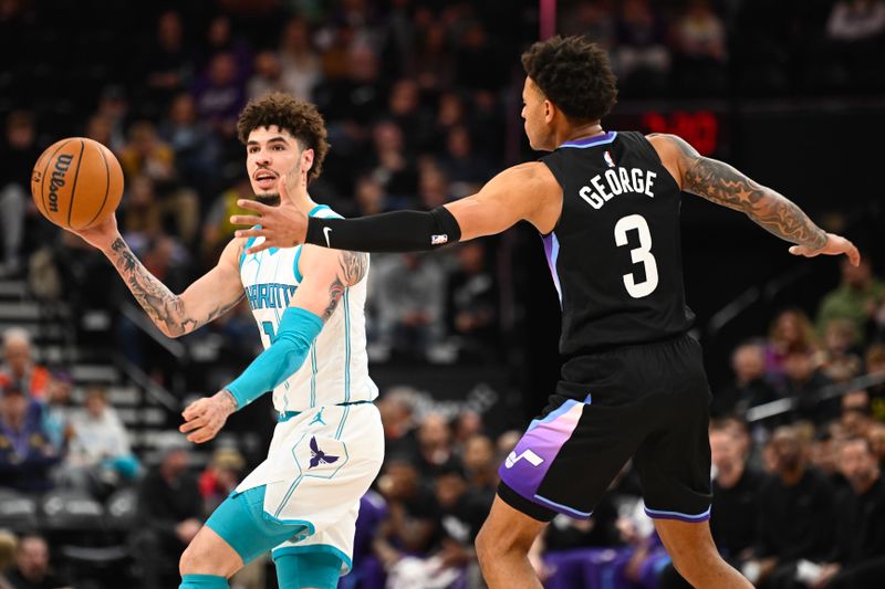 SALT LAKE CITY, UTAH - JANUARY 15: LaMelo Ball #1 of the Charlotte Hornets passes around Keyonte George #3 of the Utah Jazz during the first half of a game at Delta Center on January 15, 2025 in Salt Lake City, Utah. NOTE TO USER: User expressly acknowledges and agrees that, by downloading and or using this photograph, User is consenting to the terms and conditions of the Getty Images License Agreement. (Photo by Alex Goodlett/Getty Images)