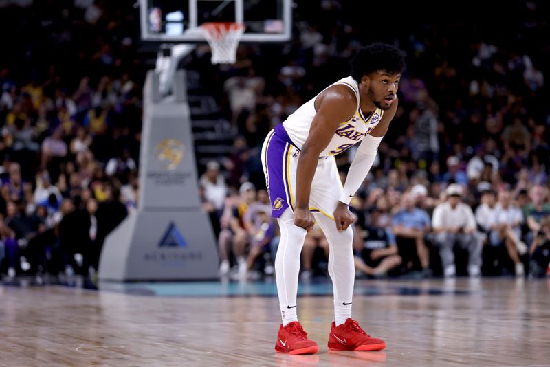 PALM SPRINGS, CALIFORNIA - OCTOBER 06: Bronny James #9 of the Los Angeles Lakers looks on from the court during the second quarter against the Phoenix Suns at Acrisure Arena on October 06, 2024 in Palm Springs, California. NOTE TO USER: User expressly acknowledges and agrees that, by downloading and/or using this photograph, user is consenting to the terms and conditions of the Getty Images License Agreement. (Photo by Katelyn Mulcahy/Getty Images)