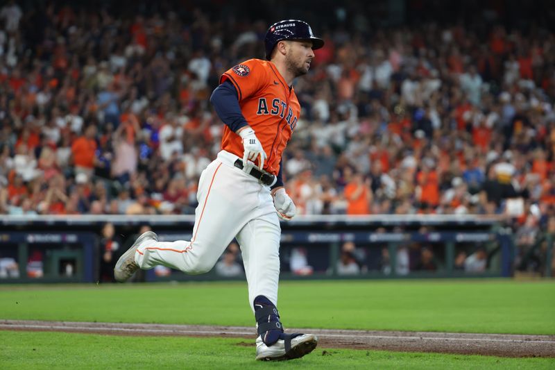 Oct 2, 2024; Houston, Texas, USA; Houston Astros third base Alex Bregman (2) runs after hitting a single against the Detroit Tigers during the second inning of game two of the Wildcard round for the 2024 MLB Playoffs at Minute Maid Park. Mandatory Credit: Thomas Shea-Imagn Images