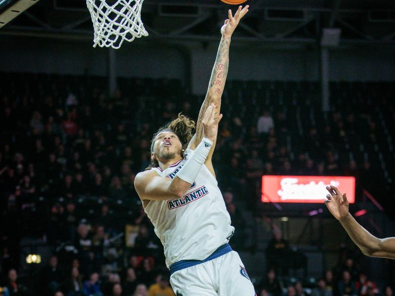 Feb 11, 2024; Wichita, Kansas, USA; Florida Atlantic Owls forward Tre Carroll (25) shoots the ball during the second half against the Wichita State Shockers at Charles Koch Arena. Mandatory Credit: William Purnell-USA TODAY Sports