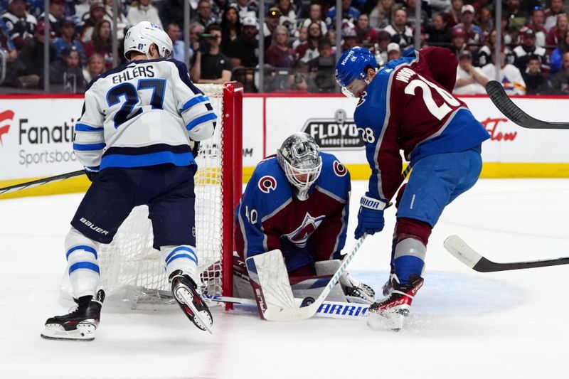 Apr 28, 2024; Denver, Colorado, USA; Winnipeg Jets left wing Nikolaj Ehlers (27) attempts to score past Colorado Avalanche goaltender Alexandar Georgiev (40) and left wing Miles Wood (28) during the first period in game four of the first round of the 2024 Stanley Cup Playoffs at Ball Arena. Mandatory Credit: Ron Chenoy-USA TODAY Sports